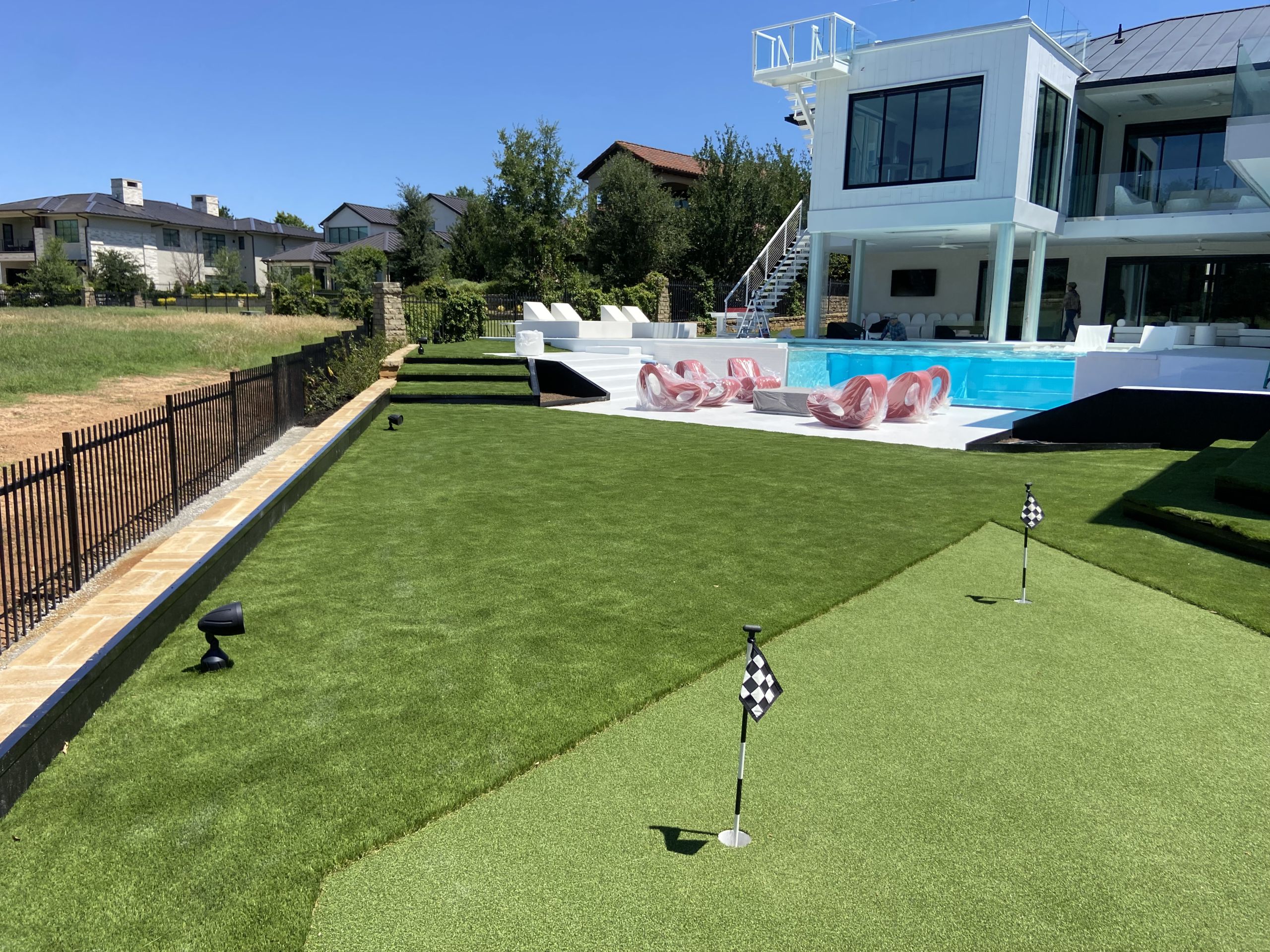 Backyard Turf Installation by Pool with Putting Green